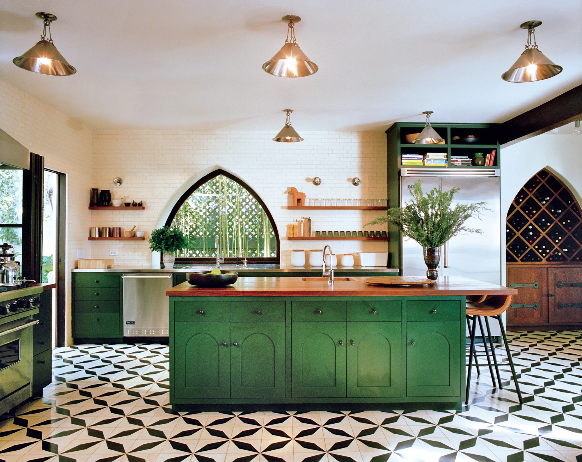 Navy kitchen island with wood countertop and herringbone tile backsplash by California HarborCrest Kitchen Design